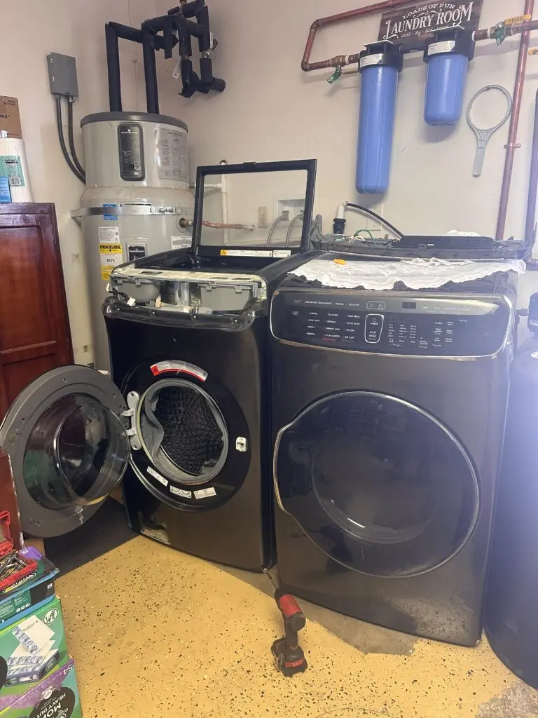 Front-load washer and dryer pair in a utility room