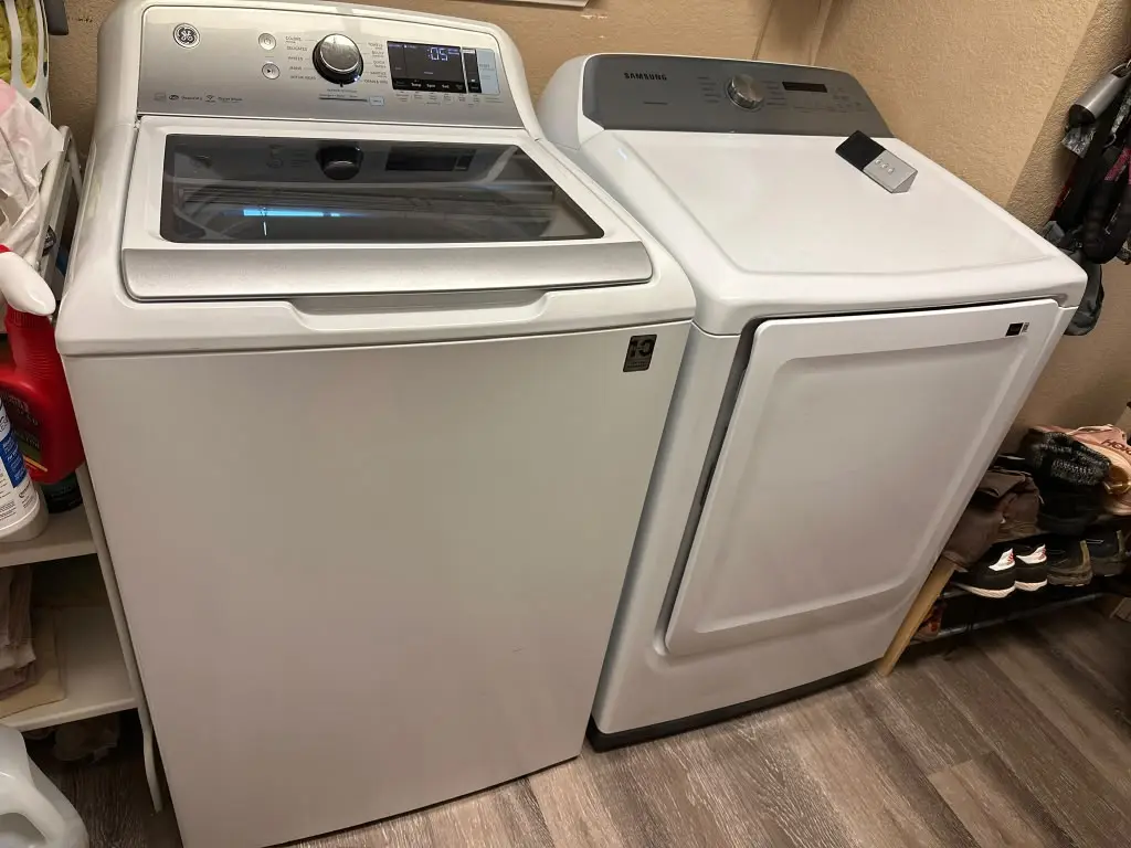 Washer Repair in {city}: Top-load washer and dryer pair in a laundry area